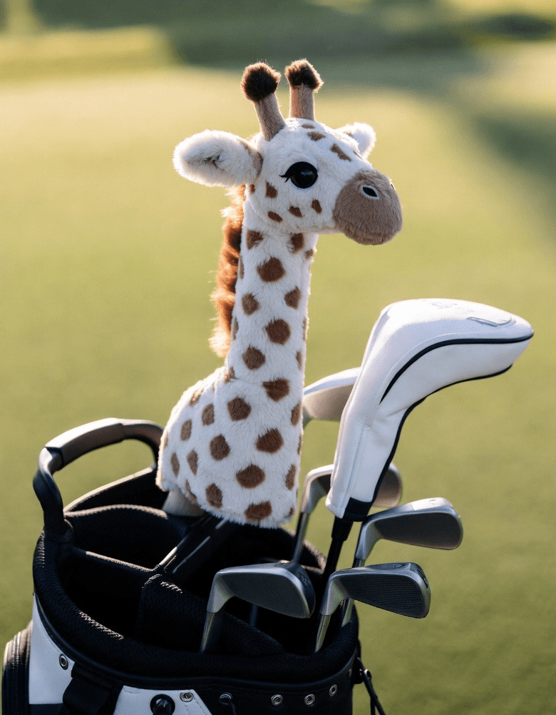 Plush giraffe headcover on golf bag